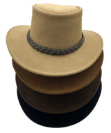 Stack of four suede outback hats in different colors.
