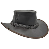 A dark brown Jacaru 101 Boundary Rider Bovine Leather Hatwith a chin strap, featuring a wide brim and a decorative braided band around the crown.