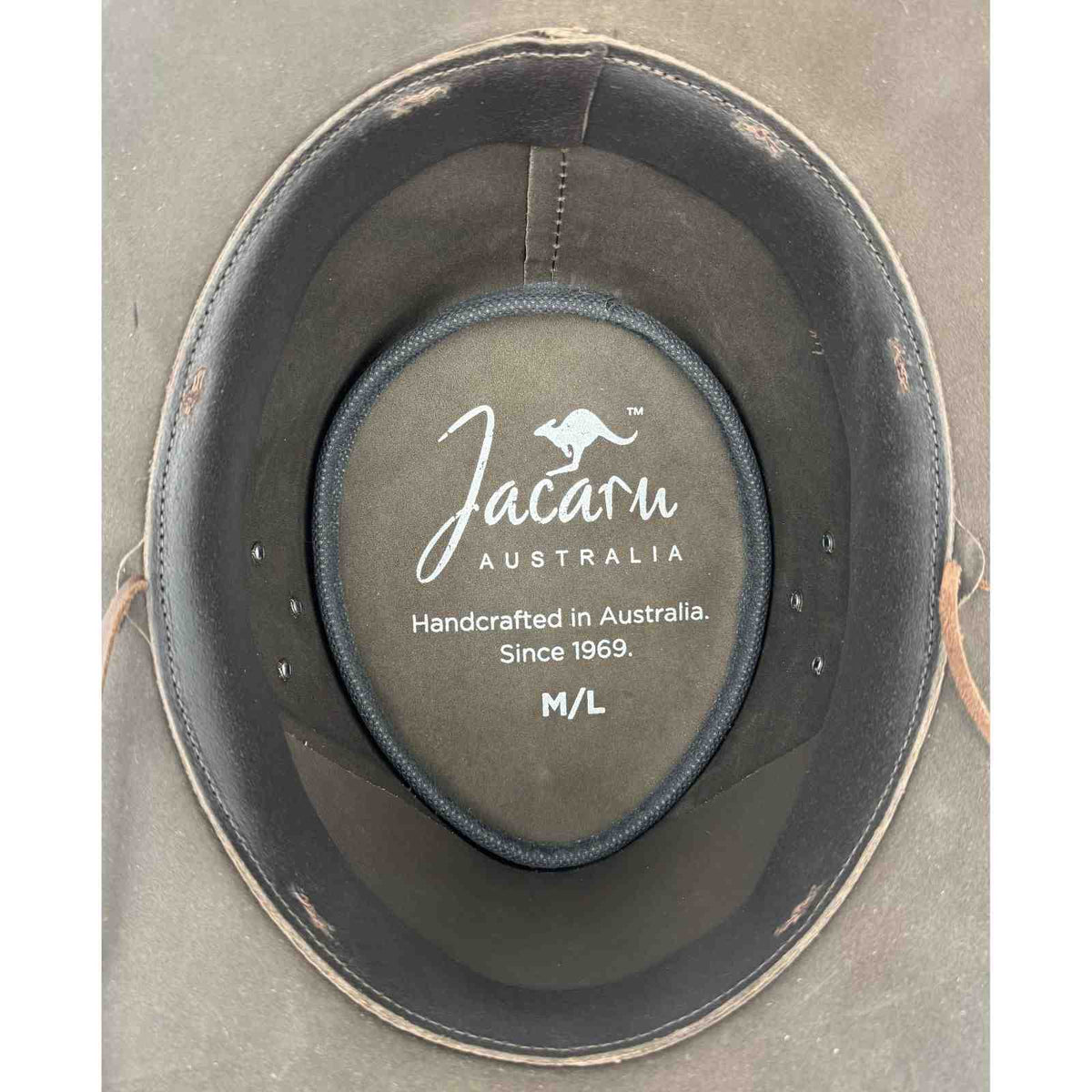 Jacaru Australia hat with brand logo and text on a gray background
