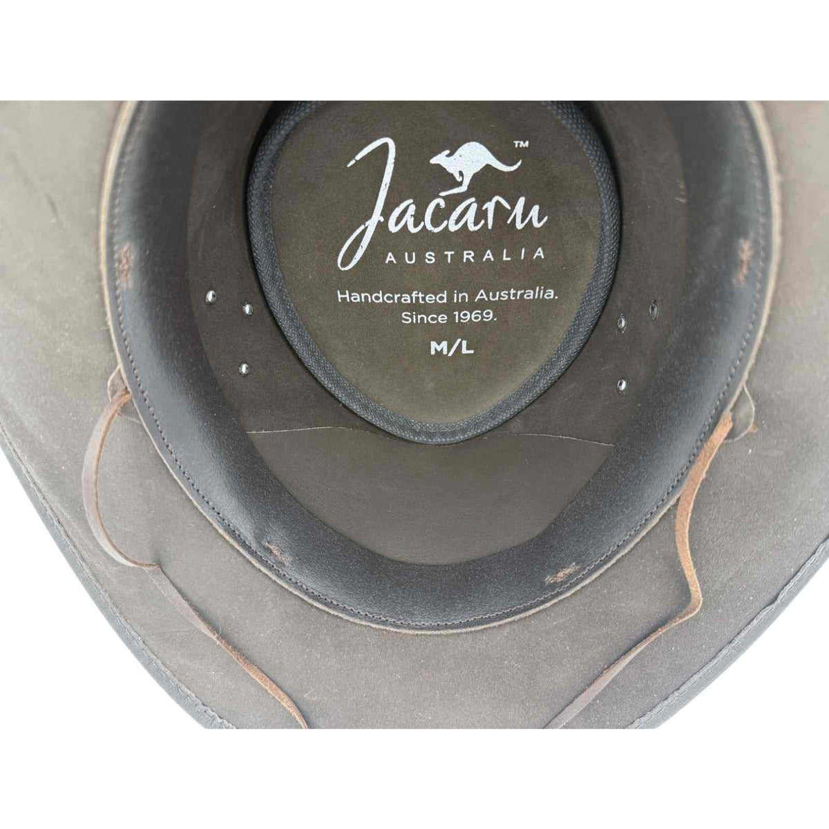 Inside of 1028 hat showing Jacaru logo and size