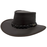A brown Jacaru 1092 Stockman hat with a braided band and a small Jacaru logo on the front, designed for sun protection.