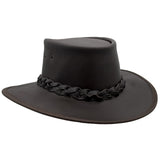 A brown Jacaru 1092 Stockman hat with a braided band and a small Jacaru logo on the front, designed for sun protection.