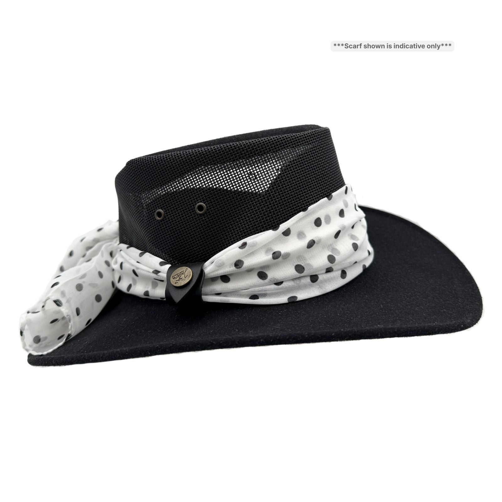 Black hat with a white polka dot scarf on a white background