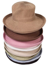 a pile of Jacaru 1506 Knitted Bucket Hat - Large Brim