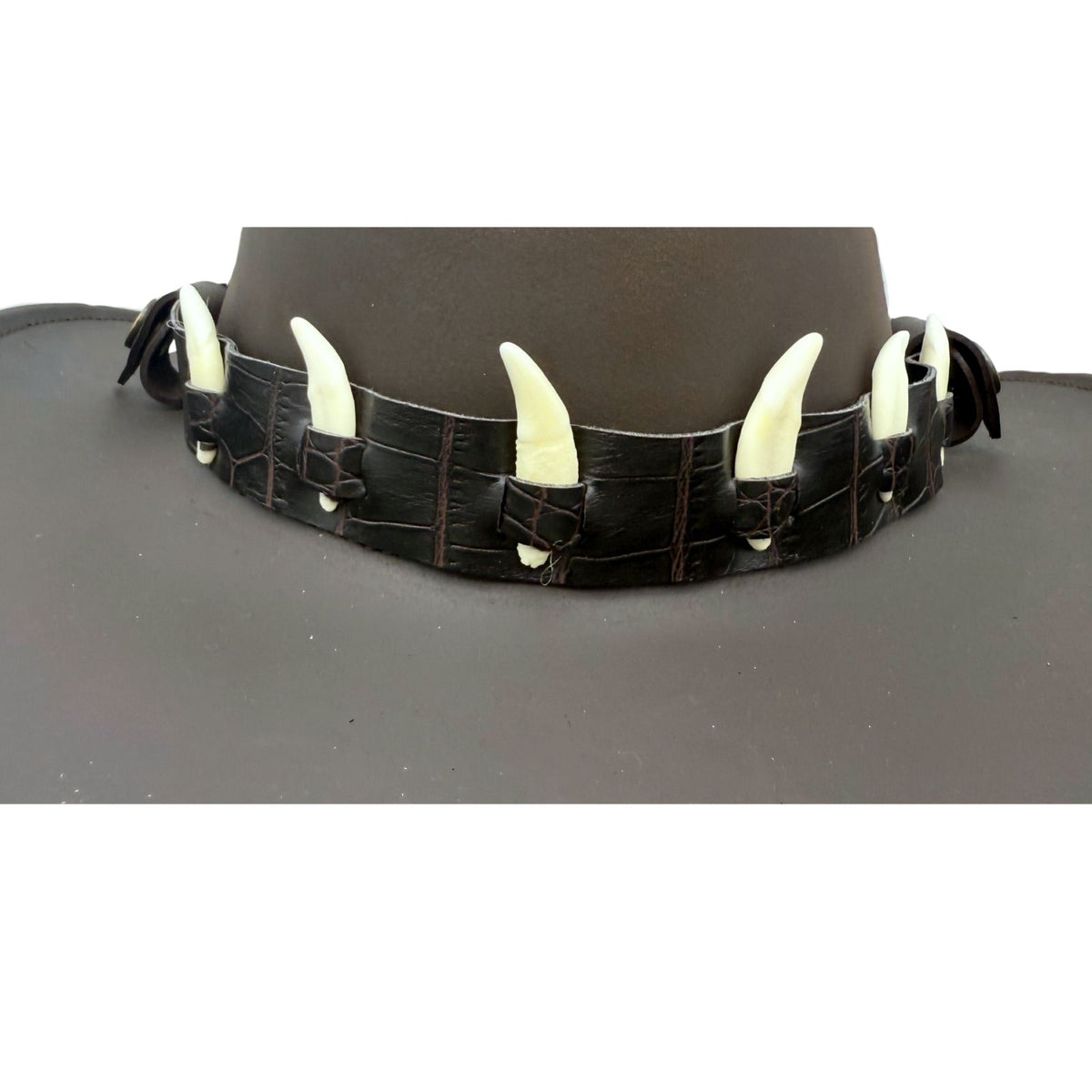 Jacaru 6582 dark leather hatband with six mini bone decorations attached to brown leather hat.