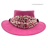 A Fuchsia Jacaru 1103 Alice hat made from vegan leather, featuring a wide brim and a multicolored scarf adorned around the base.