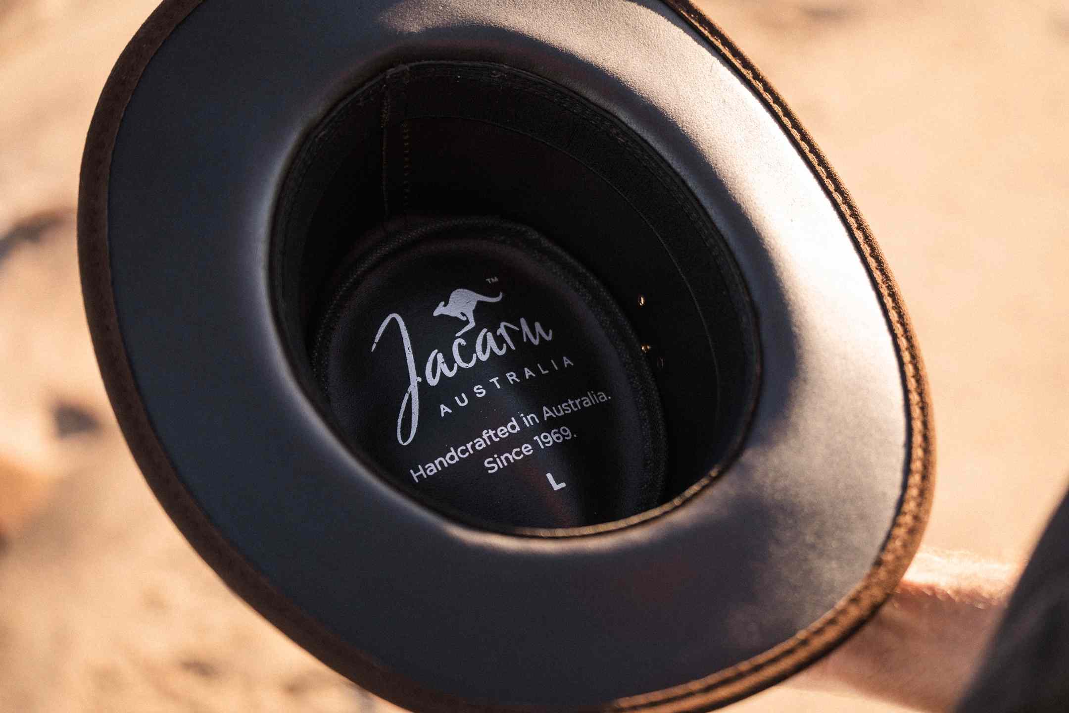 Close-up of a black cup holder with 'Jacaru Australia' branding.