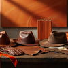 Professional header image for list-based article: The Men's Leather Hat Guide: Styles, Materials and How to...
