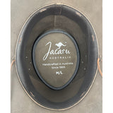 Jacaru Australia hat with brand logo and text on a gray background