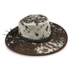 A Jacaru 1049 Rustler leather hat with a cowhide pattern and a braided leather band.