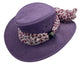 A Purple Jacaru 1103 Alice hat made from vegan leather, featuring a wide brim and a multicolored scarf adorned around the base.