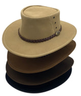 Four stacked suede outback hats from tan to dark brown.