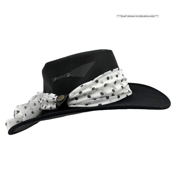 Black wide-brimmed hat with a white scarf with black polka dots on a white background