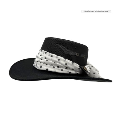 Black hat with a white polka dot scarf on a white background
