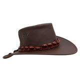 Brown Jacaru 1134 Wild Roo Croc Digger Hat with a decorative band on a white background