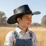 a child wearing Limited Edition brown Jacaru 1301C Children's Croc
