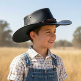 a child wearing Limited Edition brown Jacaru 1301C Children's Croc