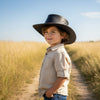 a child wearing a brown waxedJacaru 1301W Children's Waxed 