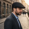 Man Wearing Black Jacaru 1850 Aston Drivers Cap 