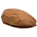 A Tan kangaroo leather driver's cap with visible stitching and a flat brim.