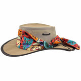A Beige and multicolored Jacaru 104A Ladies Camper hat with a scarf, made of canvas with a mesh crown, designed for ventilation.